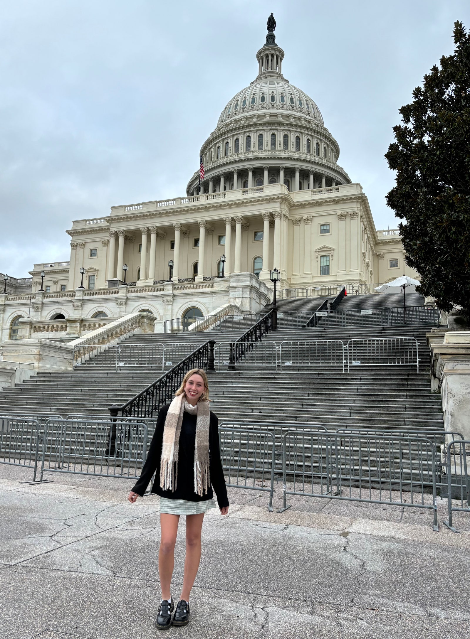 Image may contain Person Teen Clothing Footwear Shoe Coat Landmark and Capitol Hill